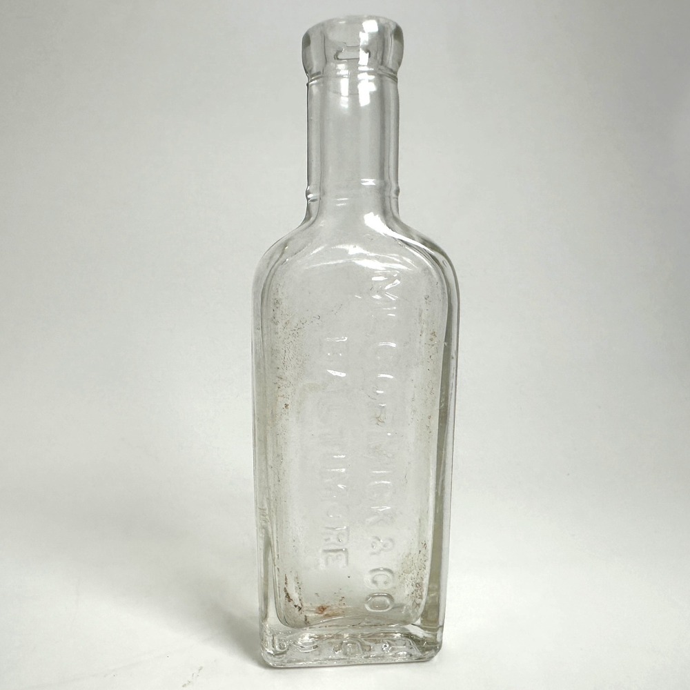 McCormick & Co Glass Bottle 5in Clear Embossed Baltimore Vintage Spice
